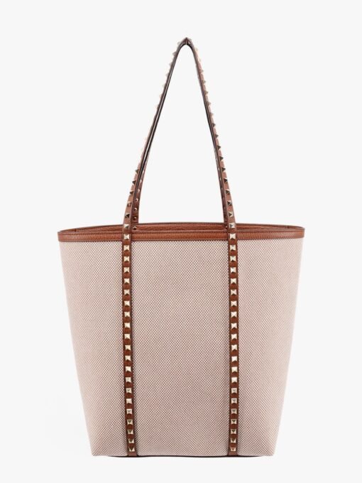 Leather and canvas shoulder bag with iconic studs